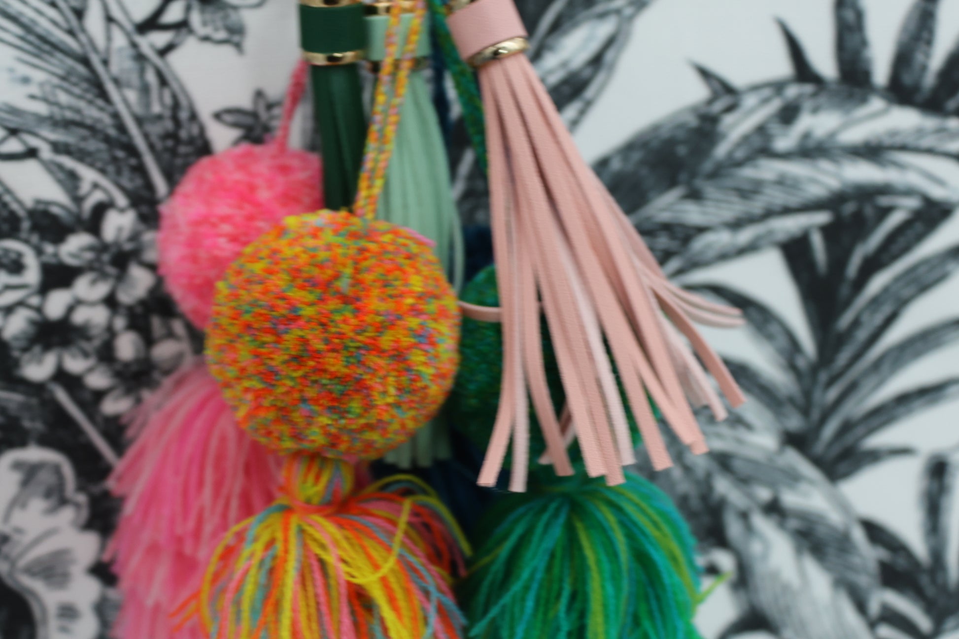 leather tassel, multi colored pompom