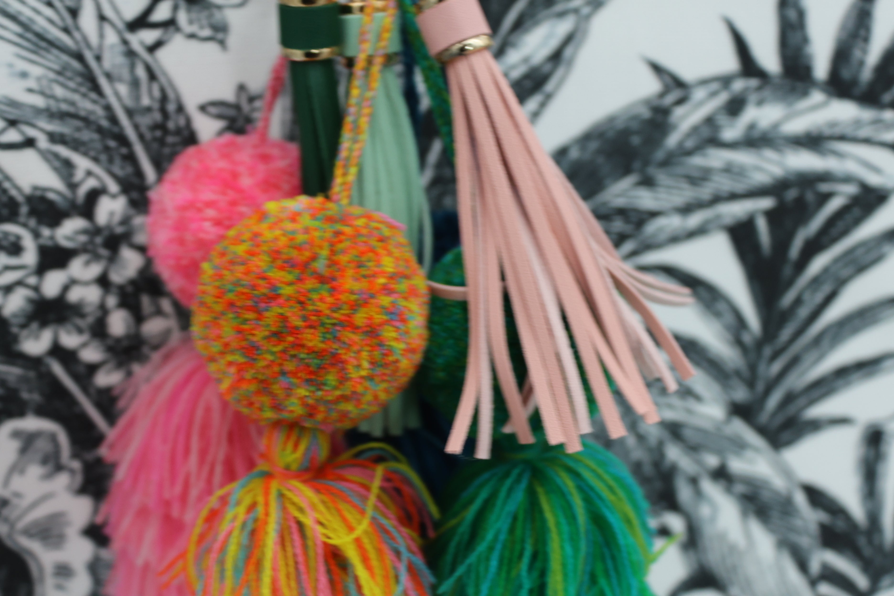leather tassel, multi colored pompom