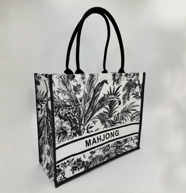 Tote bag with black floral design and 'MAHJONG' text on a white background
