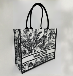 Tote bag with black floral design and 'MAHJONG' text on a white background