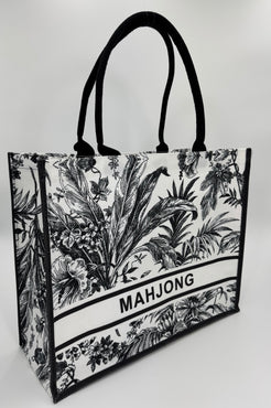 Tote bag with black and white floral design and 'MAHJONG' text on a white background