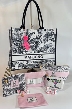 Set of 'MAHJONG' branded bags and pouches with floral design on a white background